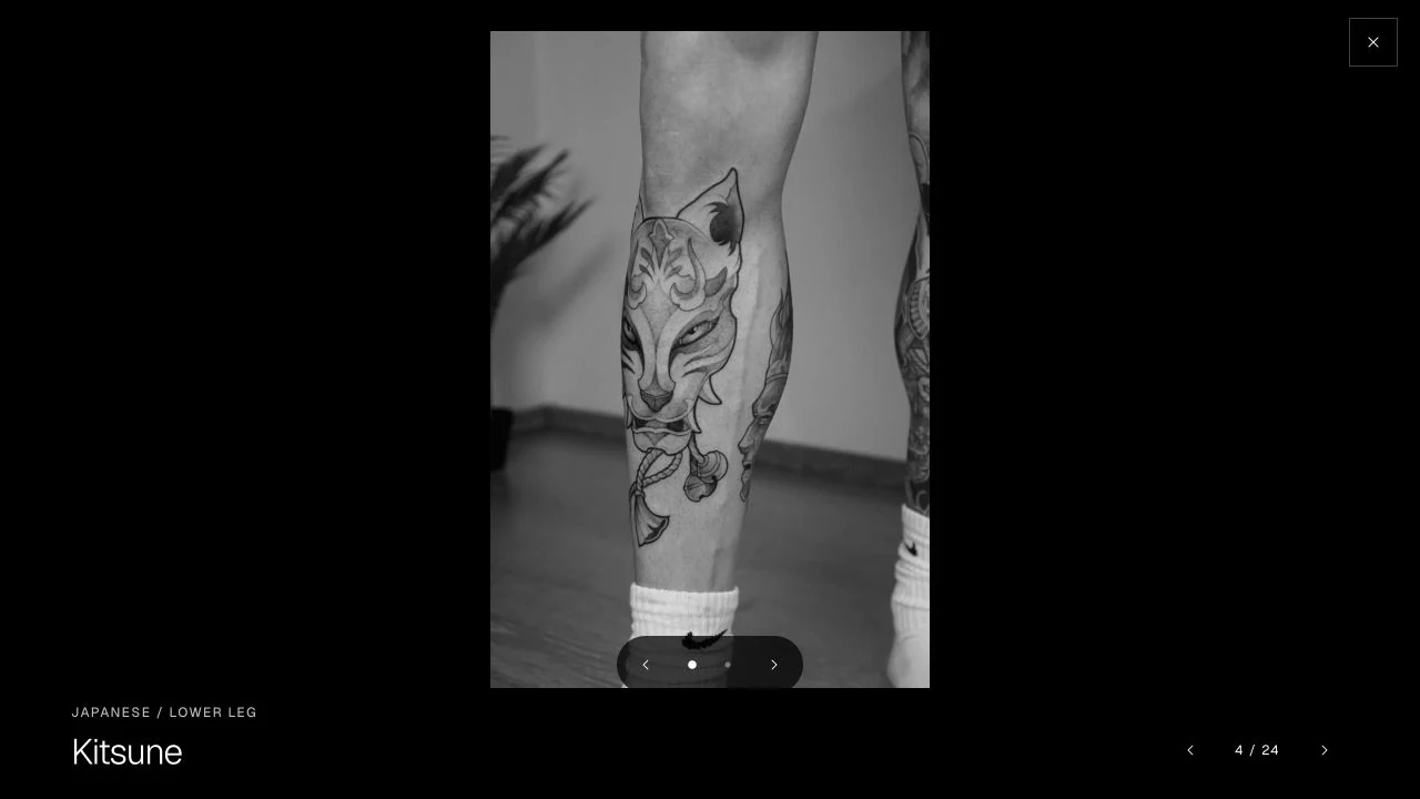 Full-screen Kitsune tattoo viewer with two perspective dots, previous and next controls, and a permanently reachable close button